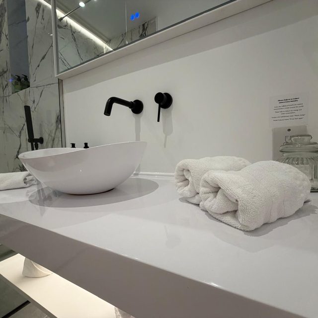 Fresh towels set out on a bathroom vanity